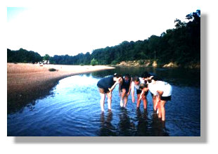 Judson students observe a live mussel in the Cahaba River