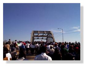 Jubilee crowd follows Presidient Clinton across Edmund Pettus Bridge