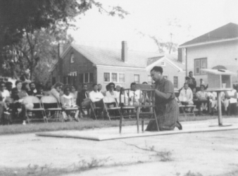 Young prays during a performance in Albany, Georgia