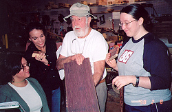 Mr. James showing students exotic wood